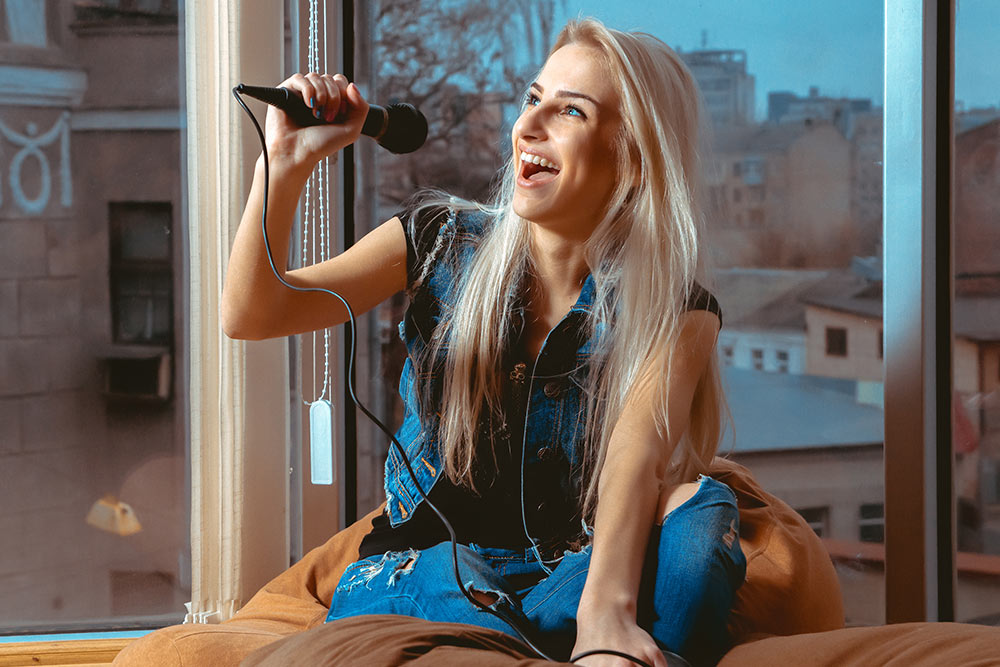 Girl singing at Virtually Talented Online Team Event